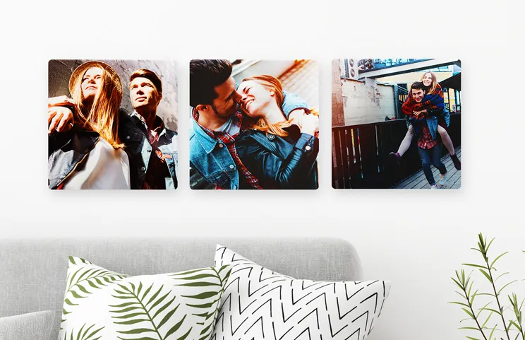 Four metal display panel photo prints with baby photos on
