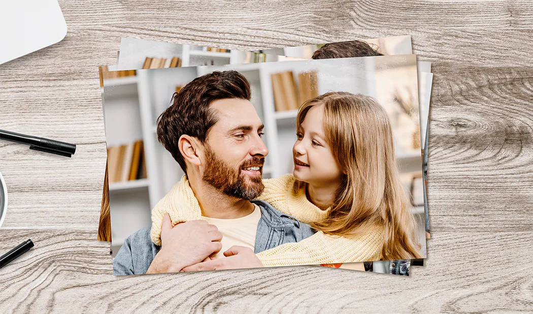 Stack of custom photo prints from the Printerpix online photo printing service