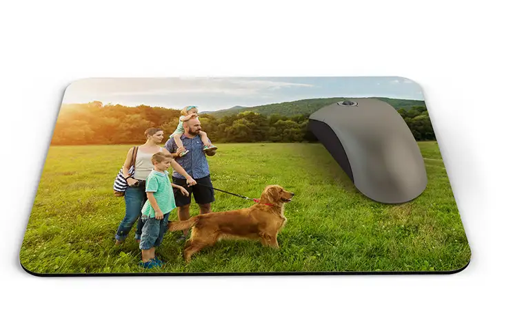 Personalised mouse mat featuring a happy family with their dog in a sun-drenched field. Create your own unique design!