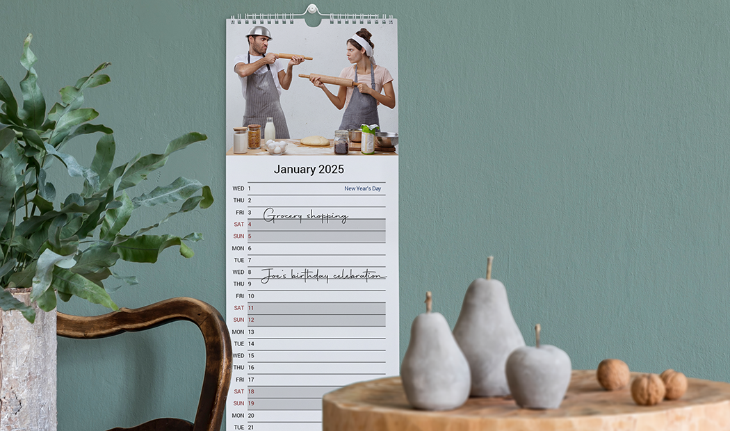 Personalised 2025 wall calendar: playful couple photo, January view, space for your events.
